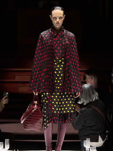 A model wearing Burberry's polka dot skirt and cape